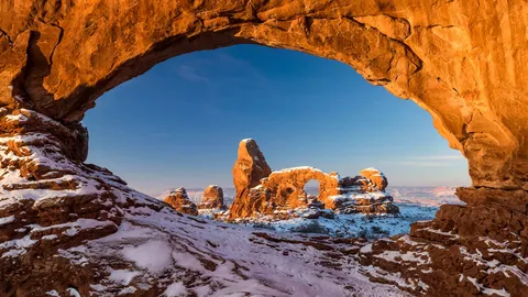 Turret Arch framed by North Window in Arches National Park, Utah, United States